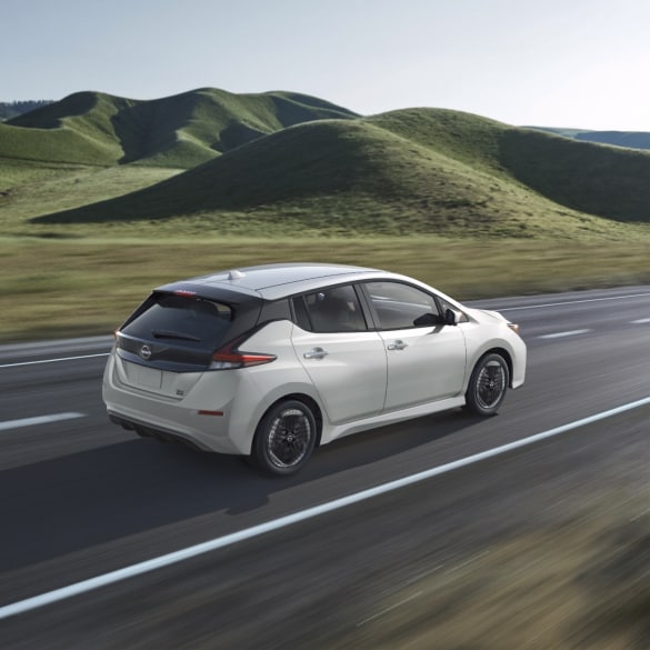 Nissan LEAF in the country surrounded by green hills
