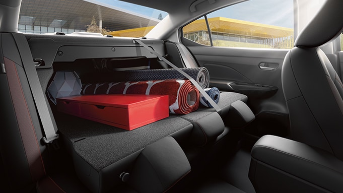2024 Nissan Versa interior view showing 60/40-split rear seats with cargo